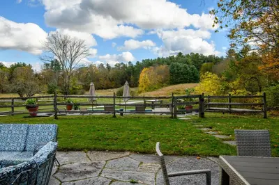 a park with a bench and a wooden fence at Elegant 7BR Estate with Pool & Hot Tub in Berkshires in North Egremont
