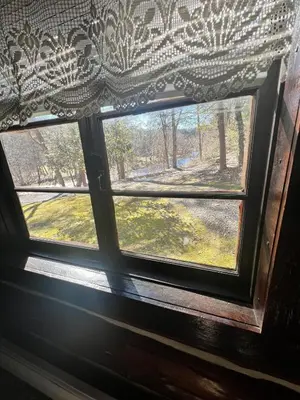 a window with a view of a field outside at Stony Creek Lodge in East Stroudsburg