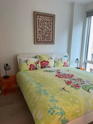 a bed with a colorful comforter in a bedroom at Brooklyn - Dumbo - 2-bedroom, 2-bath apartment in Brooklyn