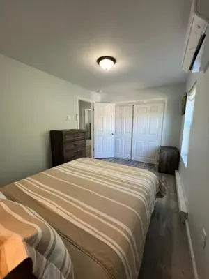 a bedroom with a large bed in a room at Chalet Montelago in The Hideout in Lake Ariel