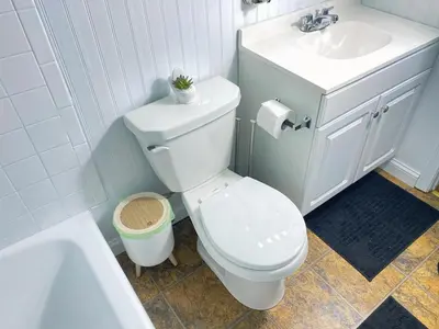 a bathroom with a white toilet and a sink at Premium convenient stays in Manchester