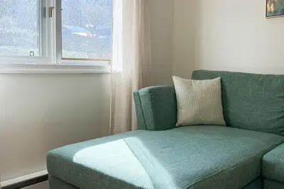 a green couch in a room with a window at Outdoors, Hiking, Skiing Mountain Vacation Getaway in Tannersville