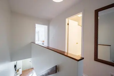 a stairwell with a mirror and a stair case at Outdoors, Hiking, Skiing Mountain Vacation Getaway in Tannersville