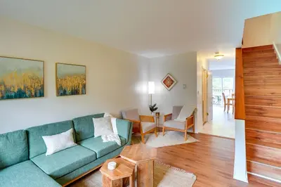 a living room with a blue couch and a table at Outdoors, Hiking, Skiing Mountain Vacation Getaway in Tannersville