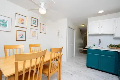 a kitchen and dining room with a wooden table and chairs at Outdoors, Hiking, Skiing Mountain Vacation Getaway in Tannersville