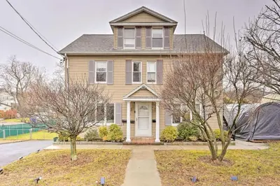 a house with trees in front of it at Charming Mamaroneck with 3BR and 3BA 22 Mi to Manhattan in Mamaroneck