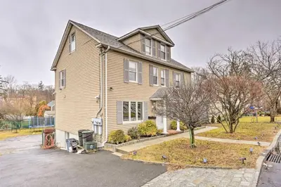 a large house with a driveway in front of it at Charming Mamaroneck with 3BR and 3BA 22 Mi to Manhattan in Mamaroneck