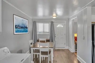 a kitchen and dining room with a table and chairs at The Main Lineup 2 - All Star Baseball Rentals in Oneonta
