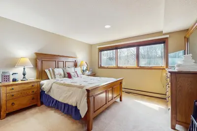a bedroom with a bed and a window at Timber Creek #100 in Dover