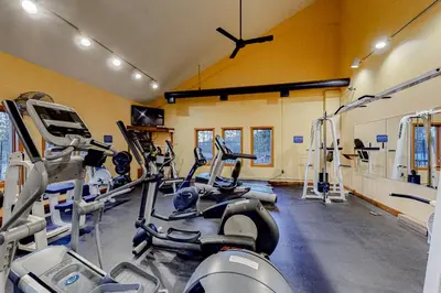 a gym with several treadmills and cardio machines at Timber Creek #100 in Dover