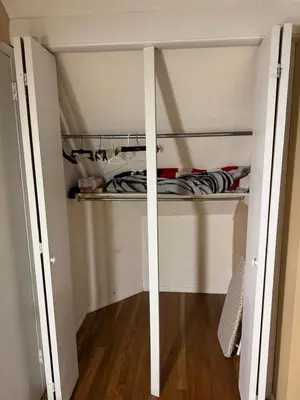 a walk in closet with shelves in a room at BedRoom with half bathroom in Ridgefield Park