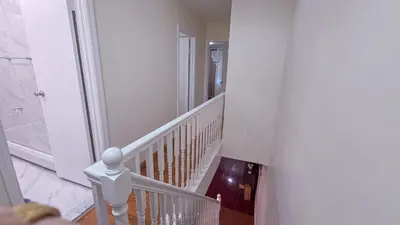 a white staircase with a white railing in a house at Amazing private single family house in Glendale