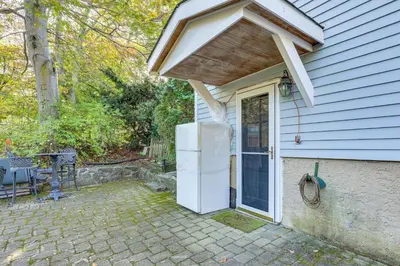 an awning over the door of a house at 2 Mi to NYC Train WFH-Friendly Greenwich Apt! in Greenwich