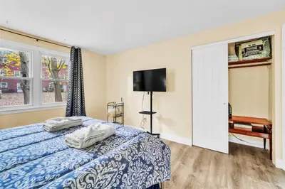 a bedroom with a bed and a tv in it at TruStay in Central Connecticut in Manchester