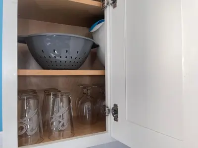 a cupboard with glass jars and a bowl on it at Peace Sterling Haven in Newark
