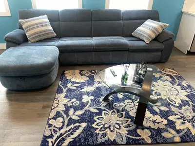 a living room with a couch and a glass table at Peace Sterling Haven in Newark