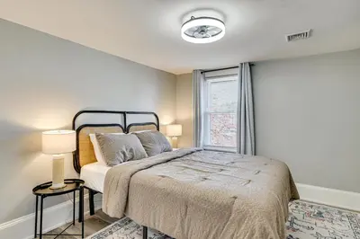 a bedroom with a bed and a window at 2 Mi to Uptown Centrally Located Kingston Apt! in Kingston