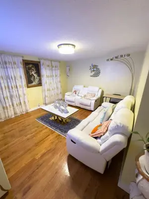 a living room with two white couches and a table at Sleeps 4 Guests Near Yale & Downtown - Free Parking in New Haven