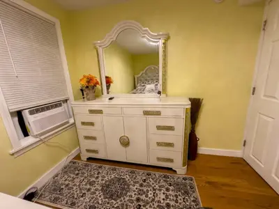 a bathroom with a white dresser with a mirror at Sleeps 4 Guests Near Yale & Downtown - Free Parking in New Haven