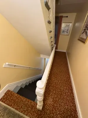 a staircase in a house with a carpet at Sleeps 4 Guests Near Yale & Downtown - Free Parking in New Haven