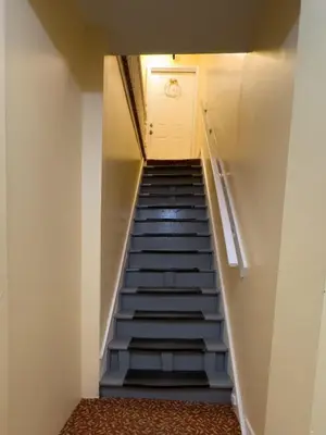 a staircase leading up to a door in a building at Sleeps 4 Guests Near Yale & Downtown - Free Parking in New Haven