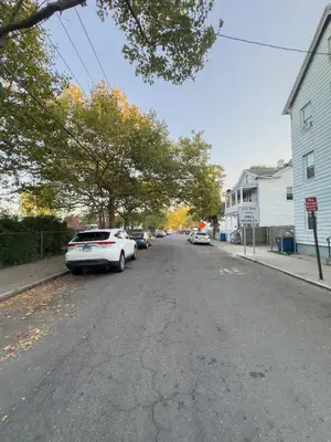 a white car parked on the side of a street at Sleeps 4 Guests Near Yale & Downtown - Free Parking in New Haven