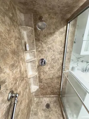 a shower with a glass door next to a sink at Sleeps 4 Guests Near Yale & Downtown - Free Parking in New Haven