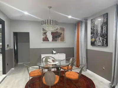 a dining room with a glass table and chairs at 3 Large Bedrooms Luxe Artistic Art Vibe in Newark