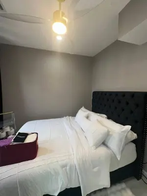 a bedroom with a large bed with white sheets and pillows at 3 Large Bedroom Designer house Spacious in Newark