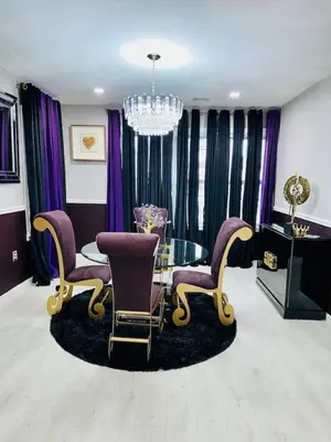 a living room with purple chairs and a glass table at 3 Large Bedroom Designer house Spacious in Newark
