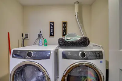 a washing machine and a washer in a room at Lakefront Pocono Retreat with Hot Tub and Movie Hub in Pocono Summit