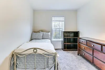 a bedroom with a bed and a dresser and a window at 8 Mi to Jiminy Peak Resort Mtn-View Home with Deck in Stephentown