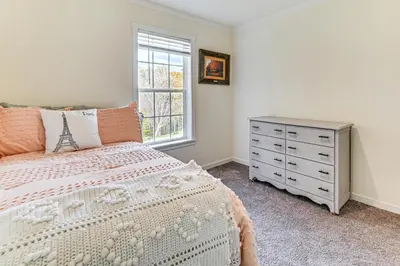 a bedroom with a bed and a dresser and a window at 8 Mi to Jiminy Peak Resort Mtn-View Home with Deck in Stephentown