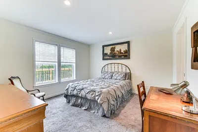 a bedroom with a bed and a desk at 8 Mi to Jiminy Peak Resort Mtn-View Home with Deck in Stephentown