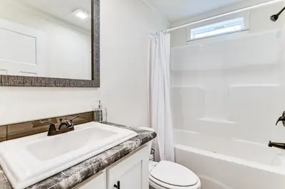 a bathroom with a sink and a toilet and a tub at 8 Mi to Jiminy Peak Resort Mtn-View Home with Deck in Stephentown