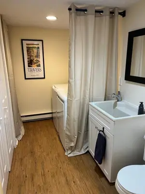 a bathroom with a sink and a toilet and a shower at In the middle of everything in Saratoga Springs