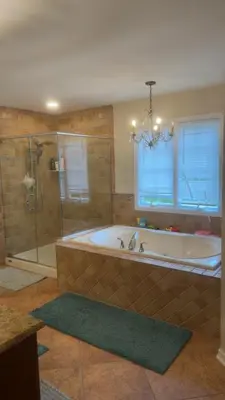 a large bathroom with a tub and a shower at villa in North Haledon