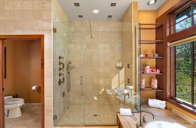 a bathroom with a shower and a sink and a toilet at Pinnacle Pointe by Relaxtay 600 Acre Private Luxury Estate with Spa, Pool, Theater and Lake in Middletown