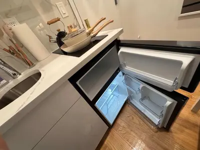 a kitchen with an open refrigerator and a sink at Room with Kitchen in Chelsea - Shared Bathroom - 3rd Floor Walk-UP in New York