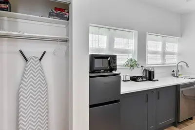 a kitchen with a sink and a microwave at Harbor Haven, Apt #1 Studio in Stamford