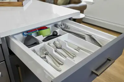 an open drawer with utensils in a kitchen at Harbor Haven, Apt #1 Studio in Stamford