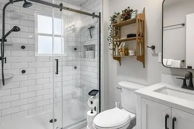 a bathroom with a shower and a toilet and a sink at Plymouth Court Turret Retreat in Milford