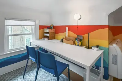 a brightly colored room with a table and chairs at Plymouth Court Turret Retreat in Milford