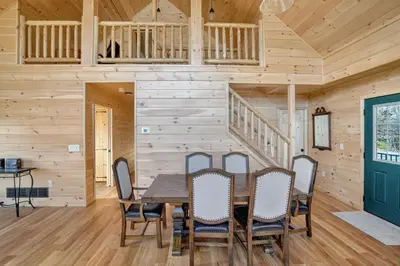 a dining room with a table and chairs at Peaceful Lakefront Cabin in the Catskills cabin in Athens