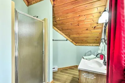 a bathroom with a shower and a sink and a mirror at Log Cabin and Suites Close to Elk Mountain Ski Resort in Pleasant Mount