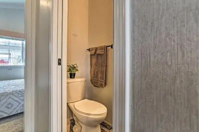 a bathroom with a toilet and a towel at Family Suites Close to Elk Mountain Ski Resort in Pleasant Mount