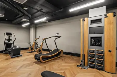 a gym with cardio machines and exercise bikes at Freeman 401 by Rove Travel - Studio w Shared Amenities in New York