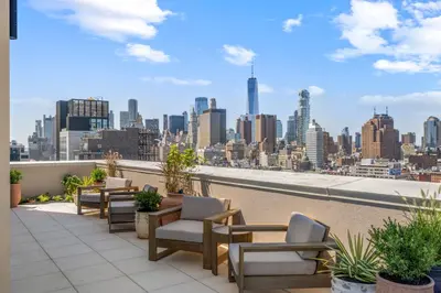 a balcony with chairs and a view of the city at Freeman 501 by Rove Travel - Studio with Shared Amenities in New York