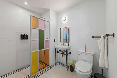 a bathroom with a toilet and a sink at Freeman 1201 by Rove Travel - Studio with Shared Amenities in New York