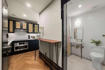 a bathroom with a toilet and a sink at Freeman 203 by Rove Travel -1BR Condo with Shared Amenities in New York